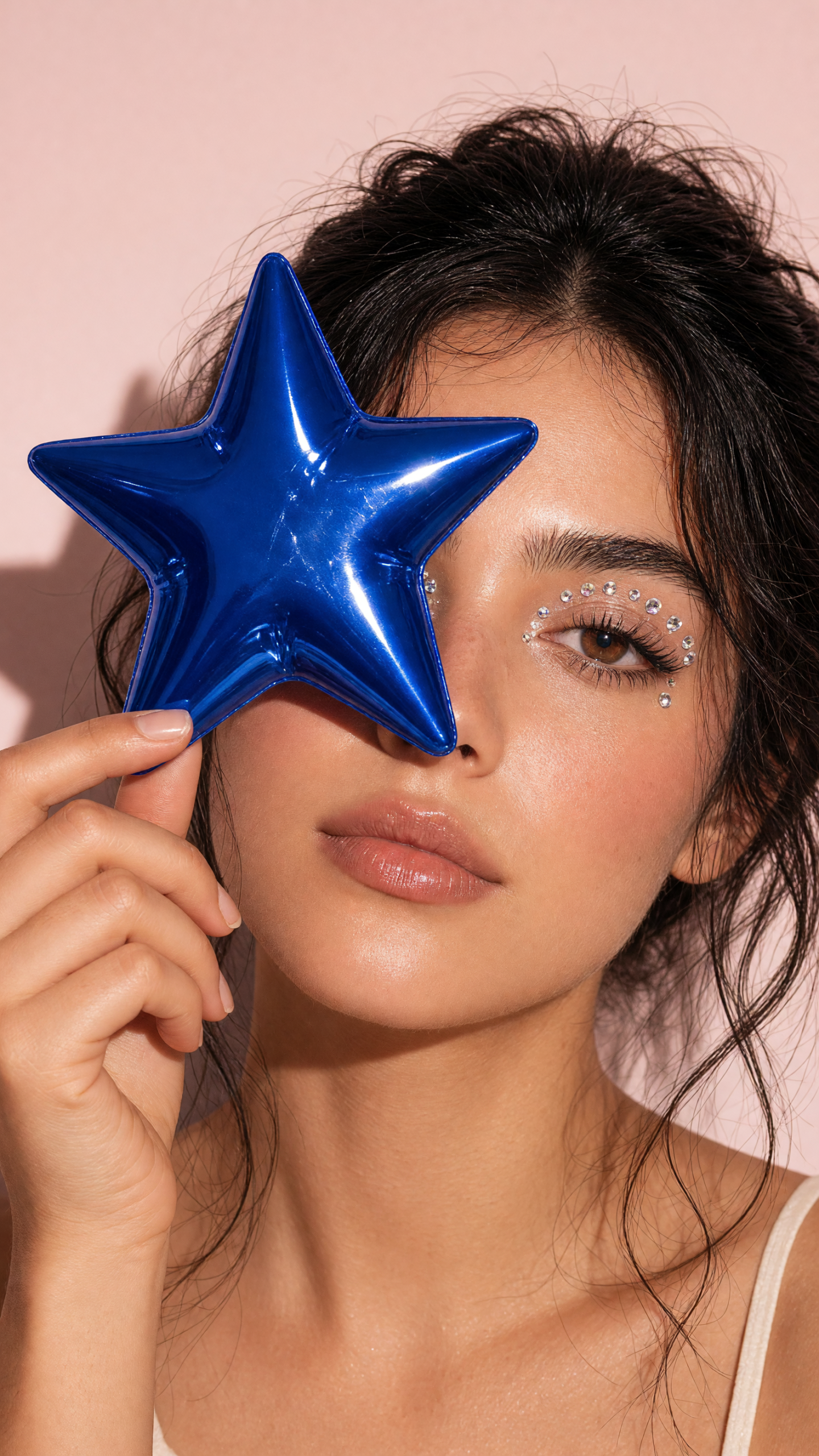 AI photo effect with a blue star sticker covering eye makeup